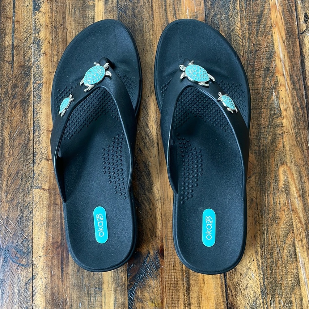 Oka B women’s flip flops with turtles, size L. Never worn.